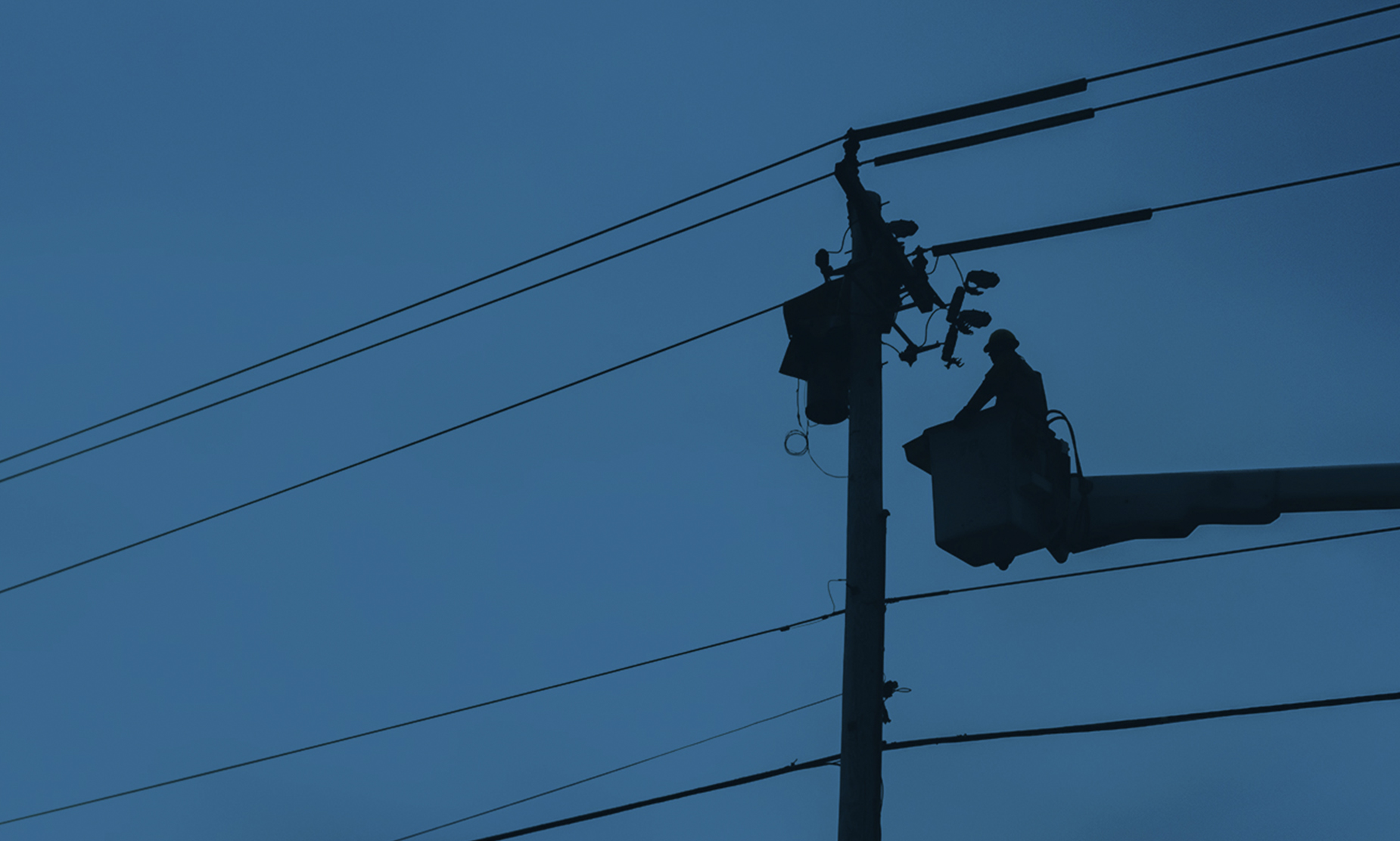 Lineman Working on Electric Pole